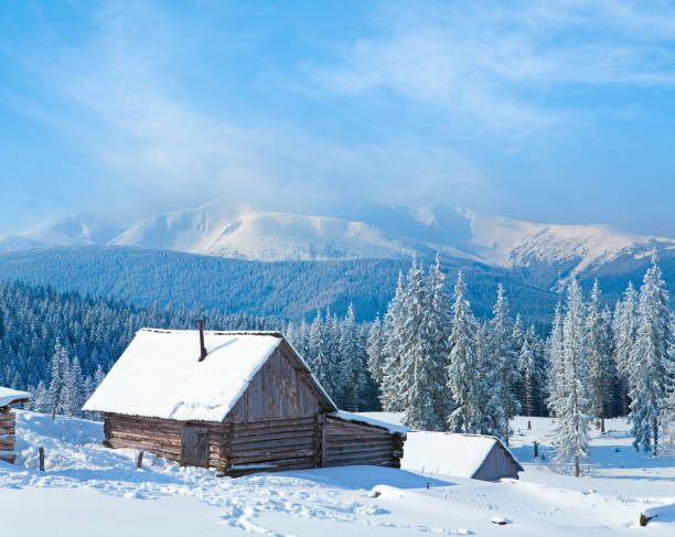 istock Winter calm mountain landscape with shed and mount ridge behind (Kukol Mount, Carpathian Mountains, Ukraine) 1540650526