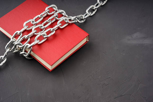 istock red book bound by a steel chain on a gray background 1540658241