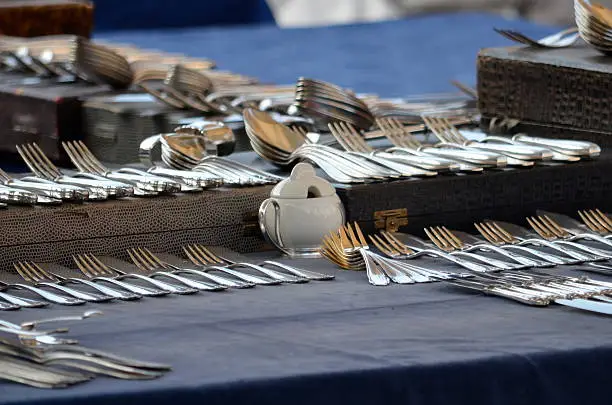 This still life situation on a Berlin flea market shows silver cutlery on display.