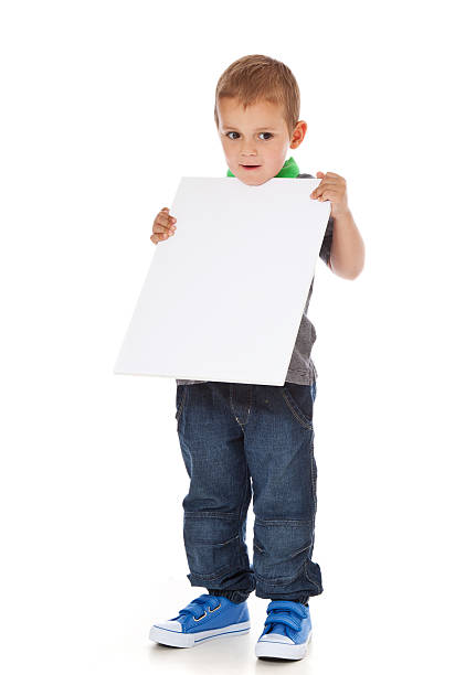 istock Cute little boy holding blank white sign 154066566