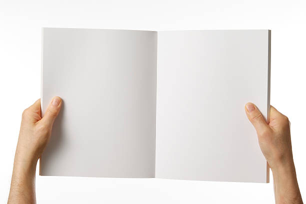 istock Holding a white blank book against white background 154066576