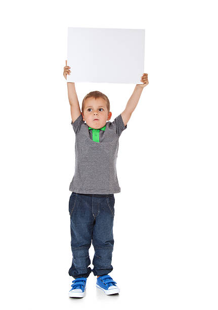istock Cute little boy lifting blank sign 154066584