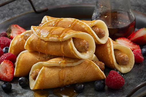 Breakfast Pancake Pigs in a Blanket with Sausage, Fruit and Maple Syrup