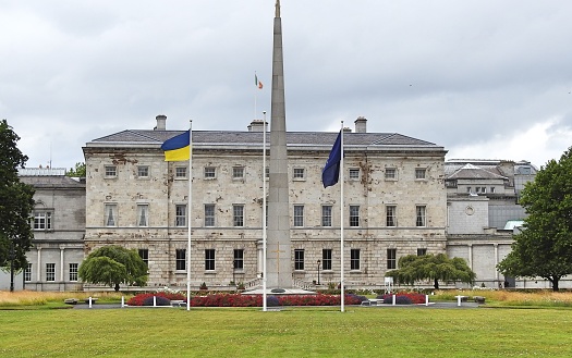7th July 2023, Dublin Ireland. Leinster House or the home of the Dail, the government of Ireland, with the Cenotaph to leaders of Irish independence monument in front, on Merrion Street, Dublin.