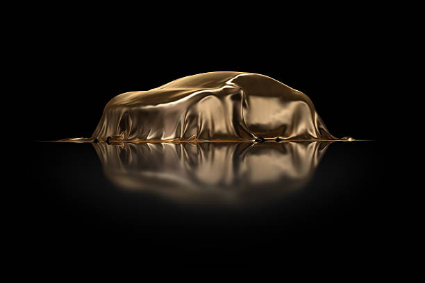 New car Presentation High resolution 3D Render of an new concept car under a golden envelope in black studio. car show stock pictures, royalty-free photos & images