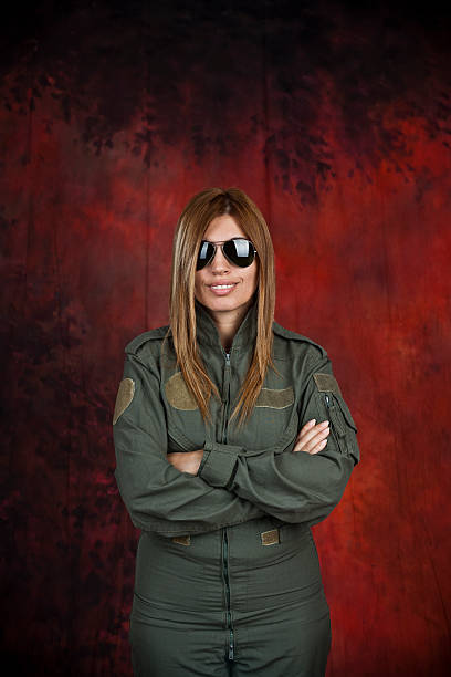 Pilot Beatifull woman pilot with sun glasses in front of red and black background beatifull stock pictures, royalty-free photos & images