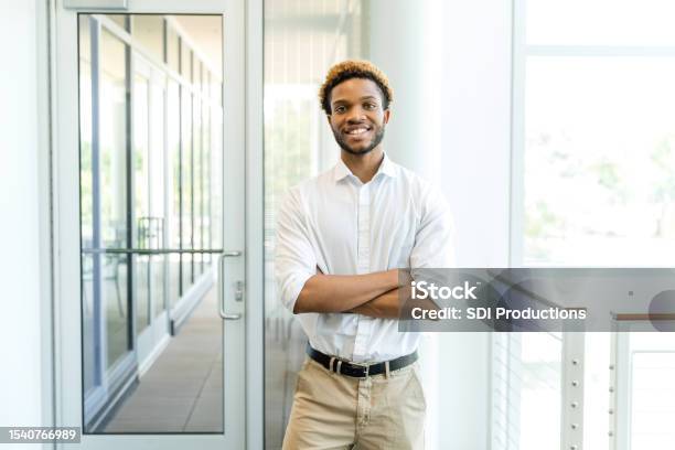 Young Adult Male Entrepreneur Poses For Photo Stock Photo - Download Image Now - Headshot, Expertise, Business Person