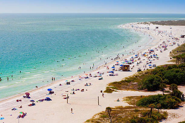 Beach goers on Lido Beach in Sarasota, FL stock photo