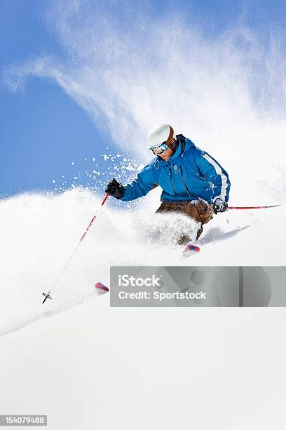 Powder Skiing Against Colorado Blue Sky Stock Photo - Download Image Now - Skiing, Ski, Downhill Skiing
