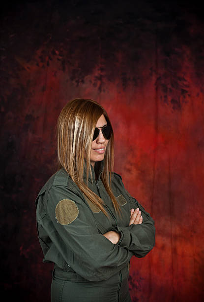 Pilot Beatifull woman pilot with sun glasses in front of red and black background beatifull stock pictures, royalty-free photos & images