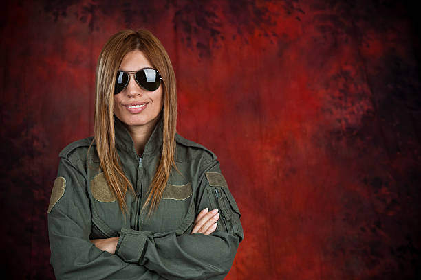 Pilot Beatifull woman pilot with sun glasses in front of red and black background beatifull stock pictures, royalty-free photos & images