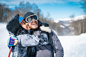 Young skiing couple enjoying their time on the mountains