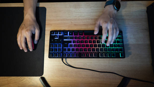 istock Young man's hand playing video game at home 1540908243