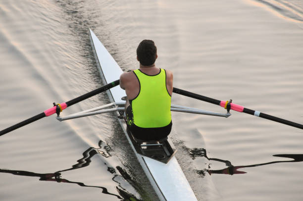 istock Young male rowing in a racing shell/scull 1540917743