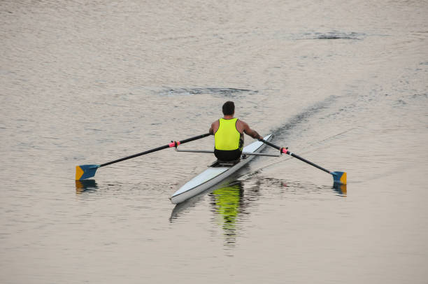 istock Young male rowing in a racing shell/scull 1540917752