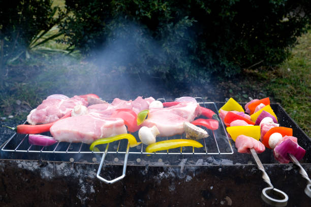 Meat and vegetables are fried on skewers. Close up. High quality 4k footage