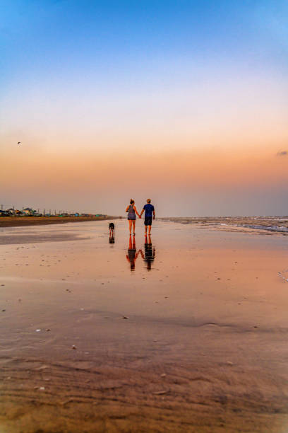 Couple Holding Hands on Galveston Beach