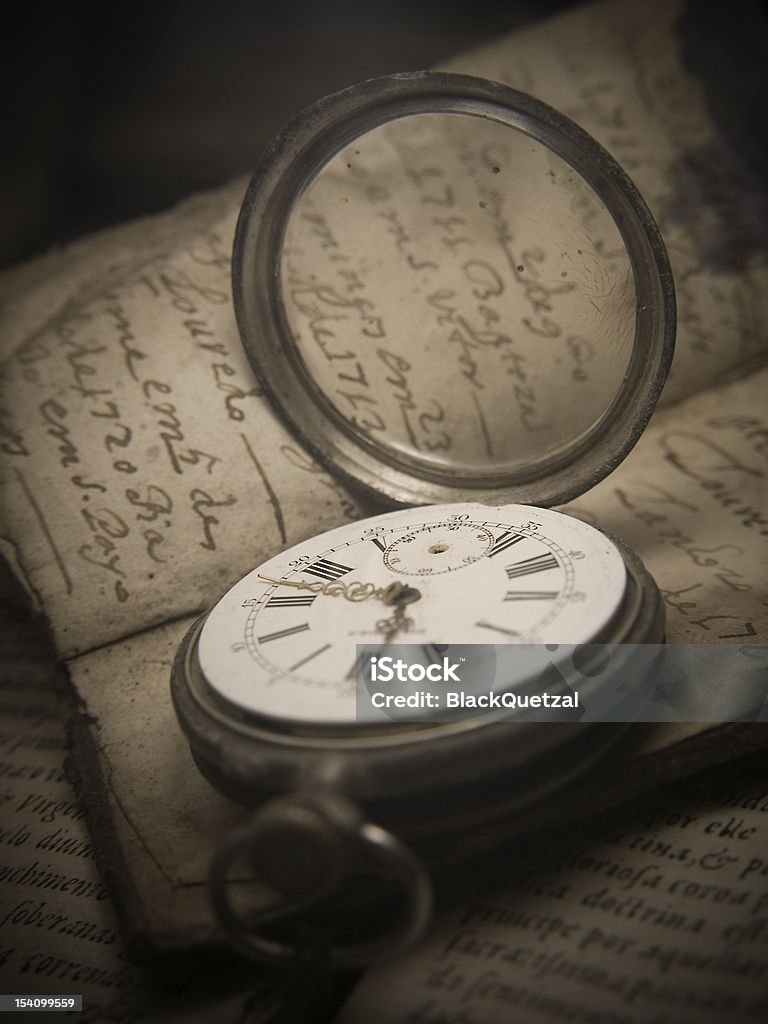 Broken Time "Still life" with watch and an old book. Antique Stock Photo