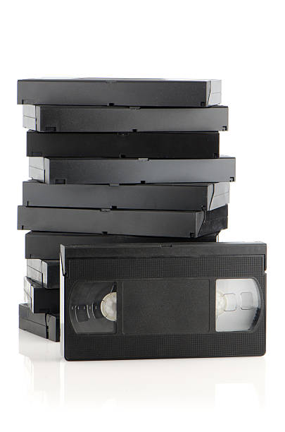 istock Black videotapes piled on top of each other 154099669