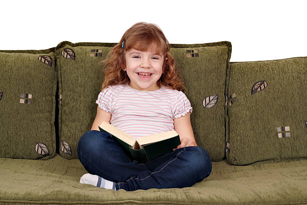 istock happy little girl reading a book 154104331