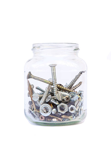 Screws, Nuts, Bolts in a Jar isolated on white