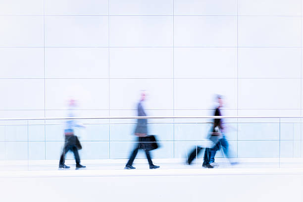 istock Many business people in blurred motion 154109117
