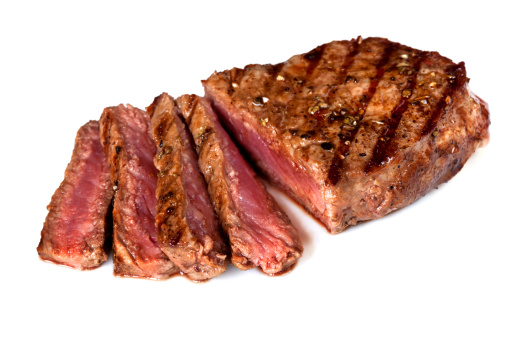 Grilled beef steak, sliced, isolated on white background.  More beef images: