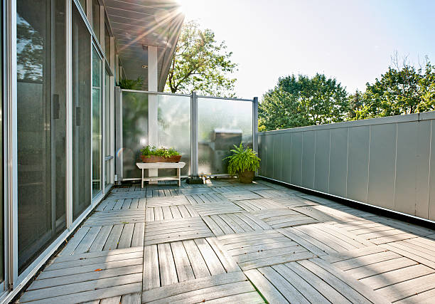 istock A wood paneled floor on an apartment balcony with plants 154111132
