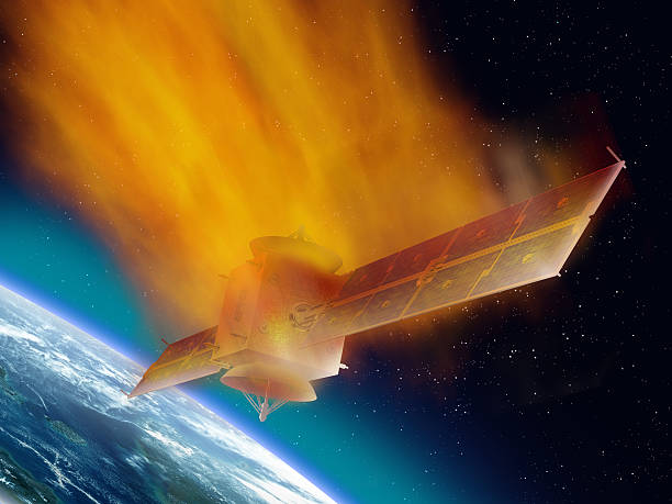 Satellite burning as it returns from space Satellite hurtling through space burning up as it enters the atmosphere stratosphere stock pictures, royalty-free photos & images