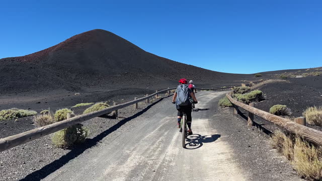 Point of view POV mountain bike on the Teide volcano in Tenerife