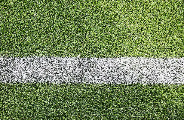 White stripe on the green soccer/football field