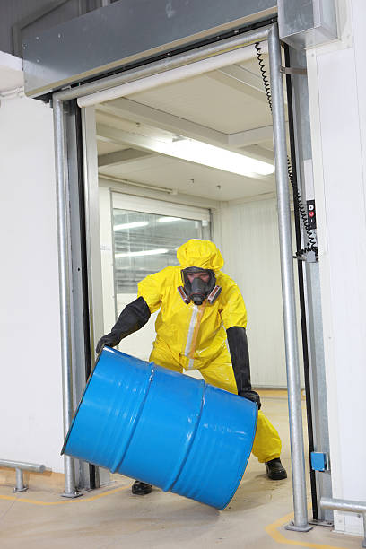 istock Worker rolling the barrel with toxic substance 154119125