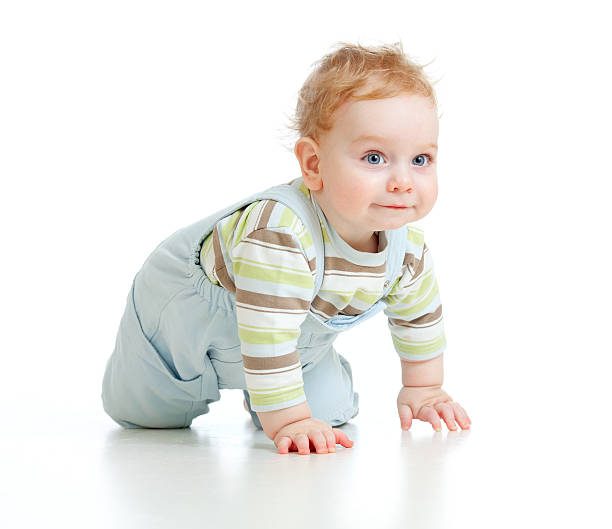 istock adorable boy crawls on all fours studio shot 154122074