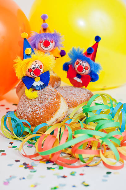 istock Krapfen or donuts with clowns and streamer 154123980