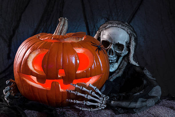 istock Skull monster and halloween pumpkin 154127117