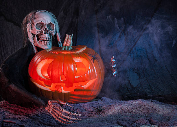 istock Skull monster and halloween pumpkin 154127152