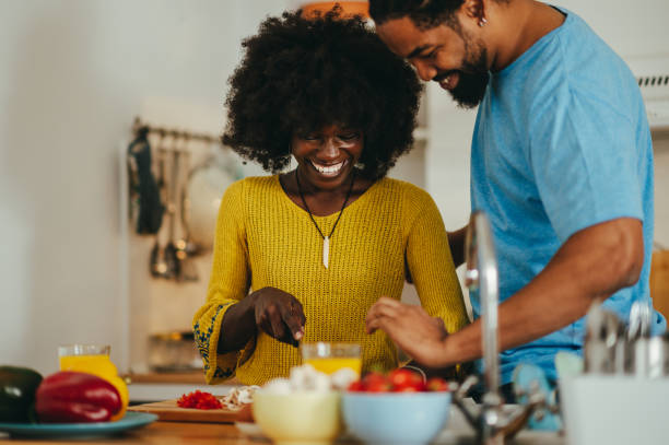 istock A cheerful interracial couple is cooking dinner at home together. 1541322207