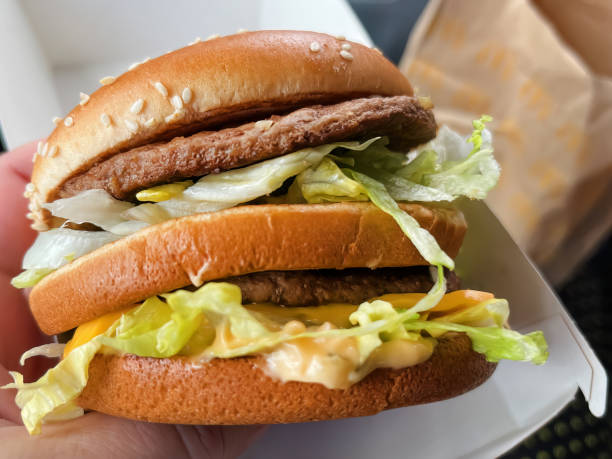 istock Classic Double-Stack Cheeseburger with Fresh Salad, Juicy Beef, and Melted Cheese 1541344307