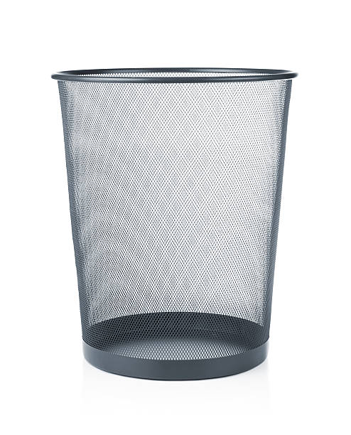 An empty waste paper basket in gray Empty trash, garbage bin isoalted on white background wastepaper basket photos stock pictures, royalty-free photos & images