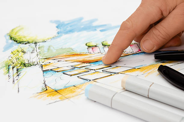 istock Landscape Architect showing Detail on Blueprint 154140668