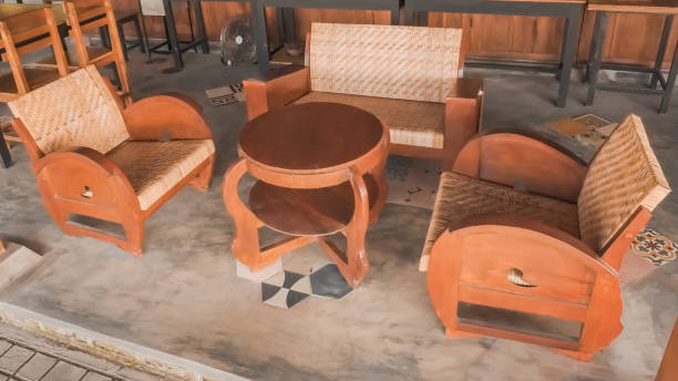 istock Javanese traditional cafe tables and chairs set made of solid wood with plastered cement floor background 1541425832