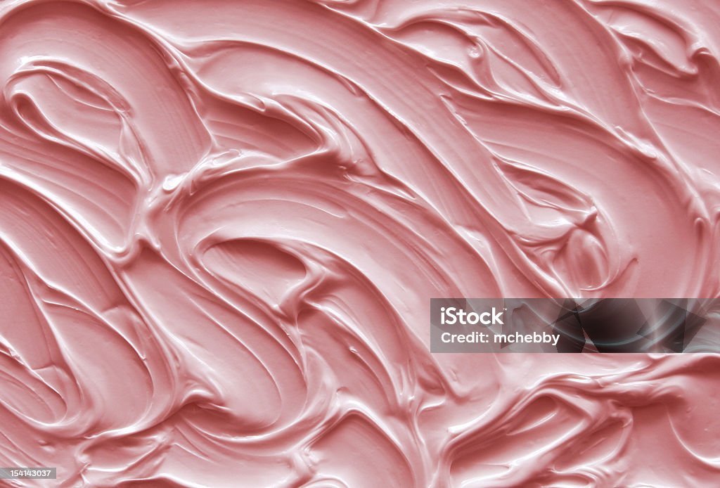 Pink Icing Pink icing with textured swirls Icing Stock Photo