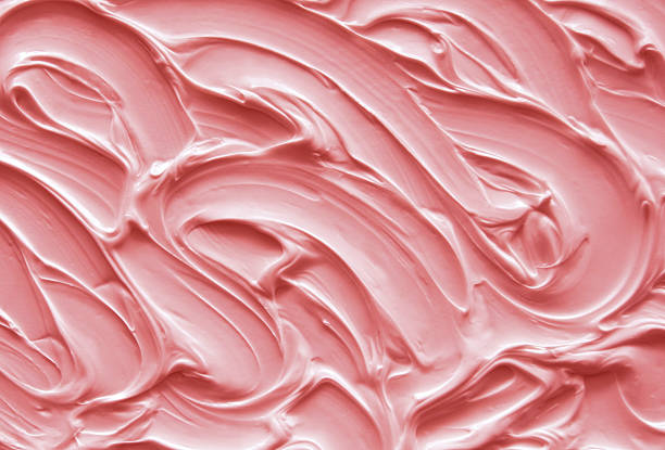 Pink Icing Pink icing with textured swirls icing stock pictures, royalty-free photos & images
