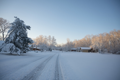 Street after a fresh snow fall in a suburban neighberhood