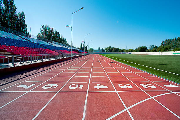 Red treadmill at the stadium stock photo