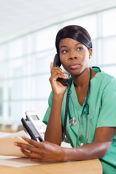 istock Nurse on the phone at work station 154150340