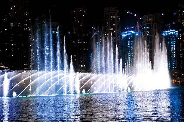 istock Colored water fountain at night 154153956