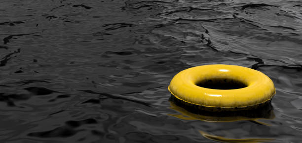 Inflatable yellow swimming ring floating in black oil. Environmental pollution background concept. 3D rendered image.