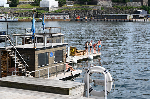 Oslo, Norway, July 7, 2023 - Oslo's floating saunas in the harbor near the Opera House.