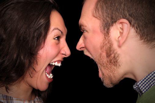 young couple screaming at each other